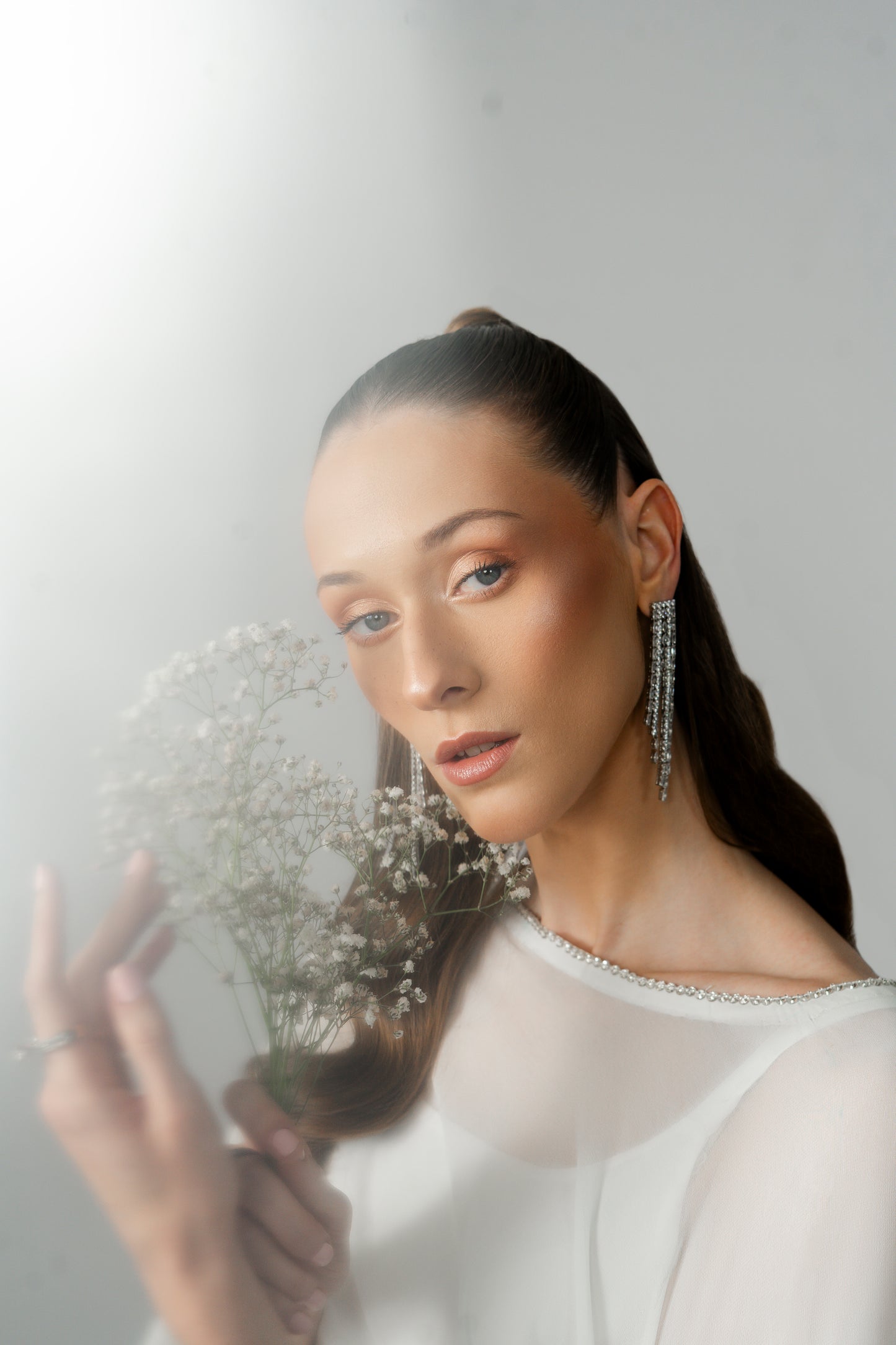 Eryss luxury formal clothing with minimalist silhouette by Noura Studio